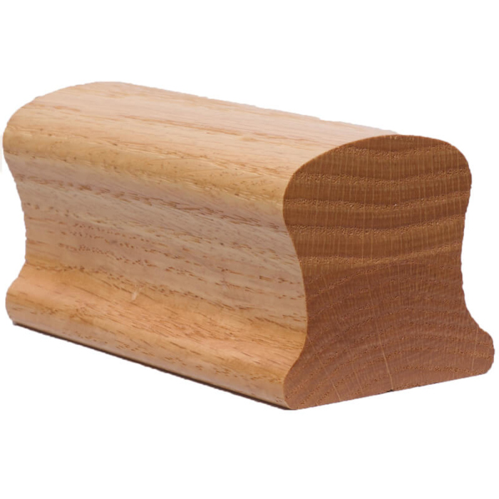 A wooden handrail segment with a rounded top and flat bottom, showing its grain and profile shape.